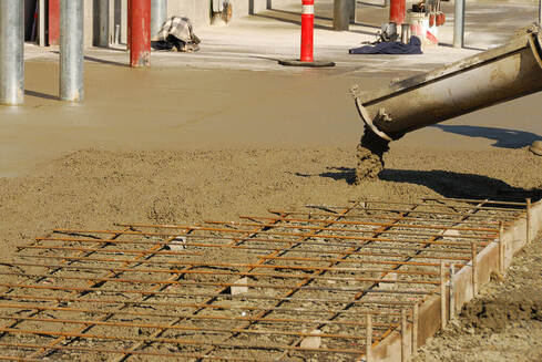 Concrete slab being poured with a concreting Ipswich truck